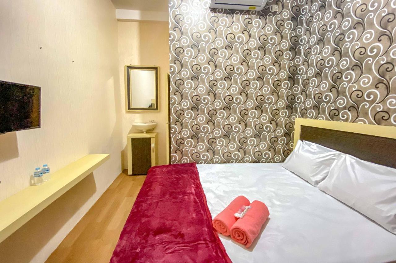Tini'S Guest House Malang Mitra Reddoorz Bagian luar foto
