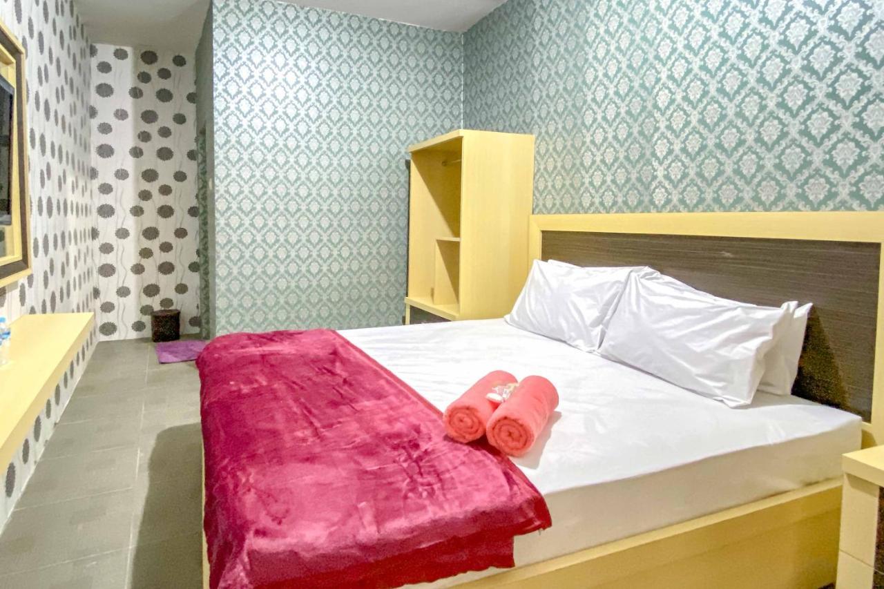 Tini'S Guest House Malang Mitra Reddoorz Bagian luar foto